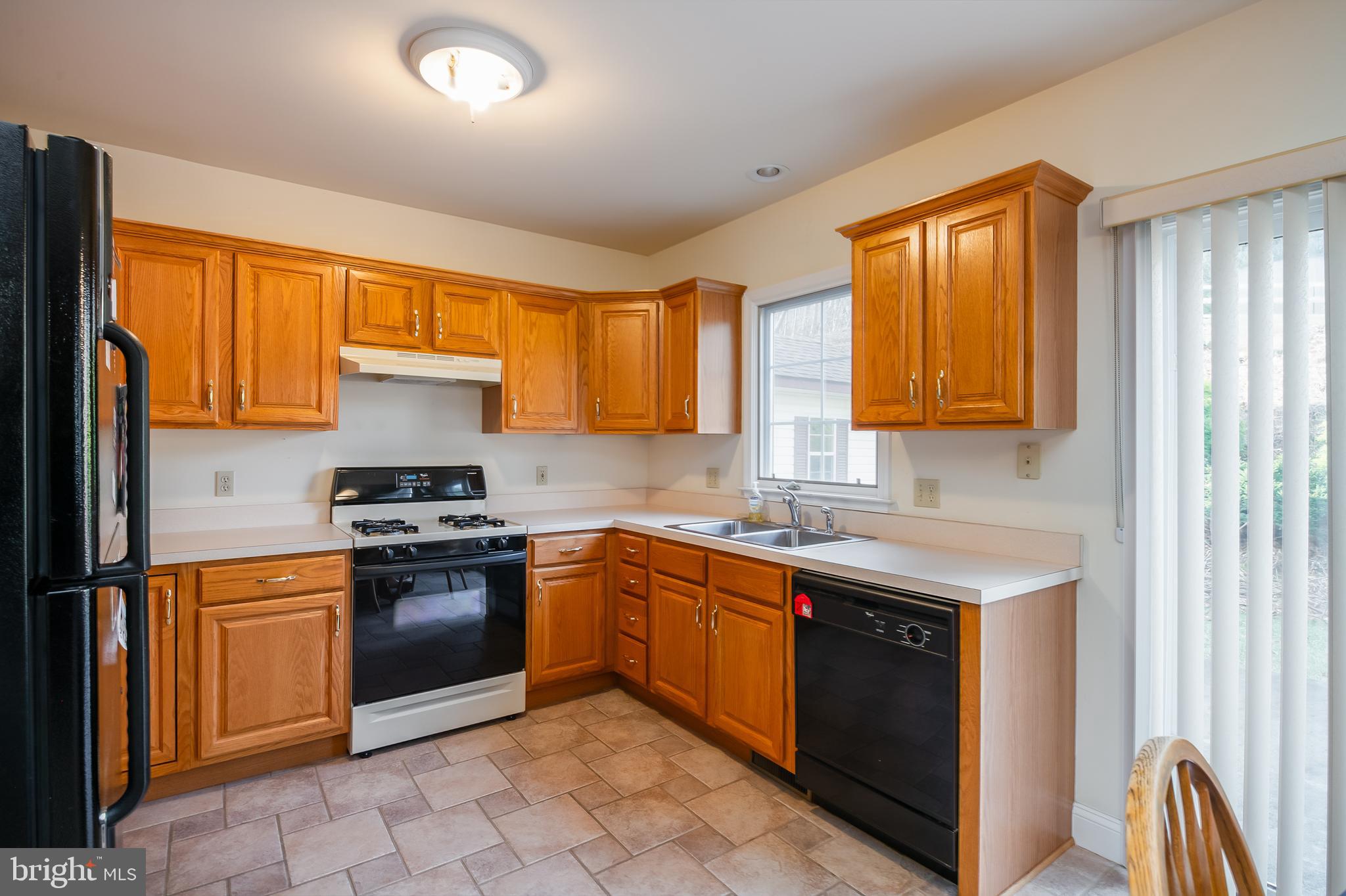 592 Wolfe Lane Mohnton, PA 19540 - Photo 2 of 31 a kitchen with stainless steel appliances granite countertop a stove sink and cabinets