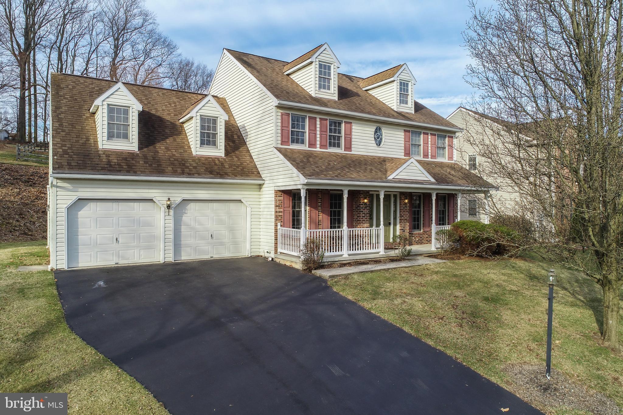592 Wolfe Lane Mohnton, PA 19540 - Photo 25 of 31 a front view of a house with a garden