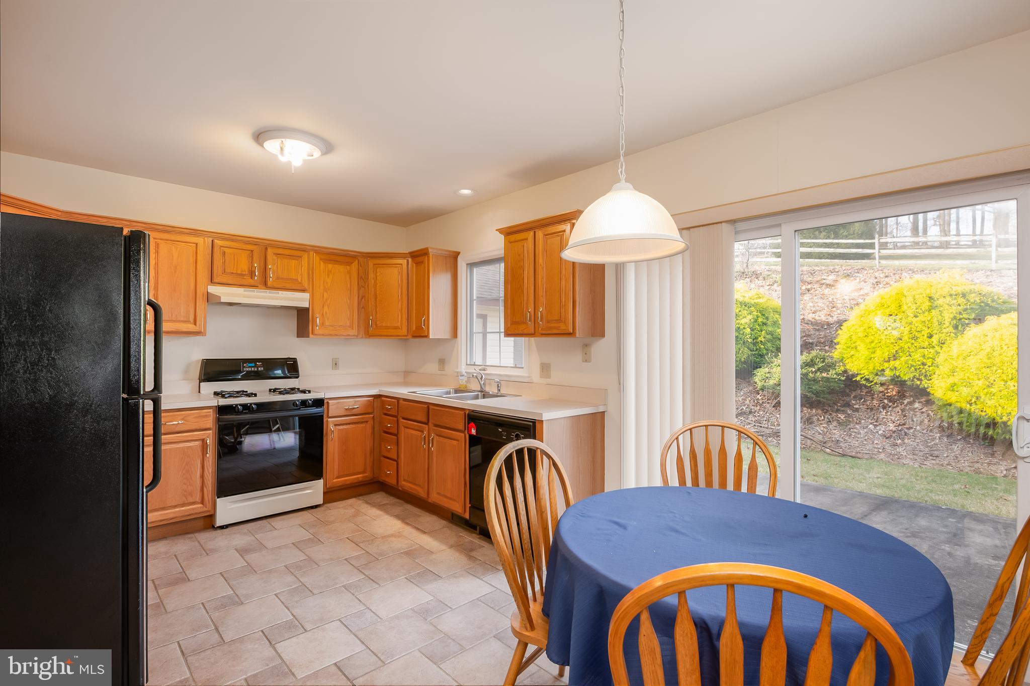 592 Wolfe Lane Mohnton, PA 19540 - Photo 4 of 31 a kitchen with stainless steel appliances granite countertop a stove and refrigerator