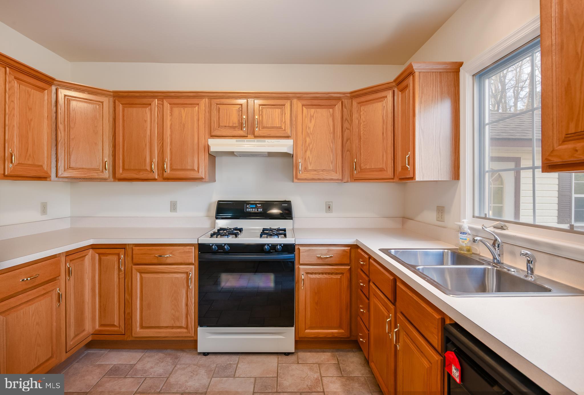 592 Wolfe Lane Mohnton, PA 19540 - Photo 5 of 31 a kitchen with stainless steel appliances granite countertop a sink stove and refrigerator