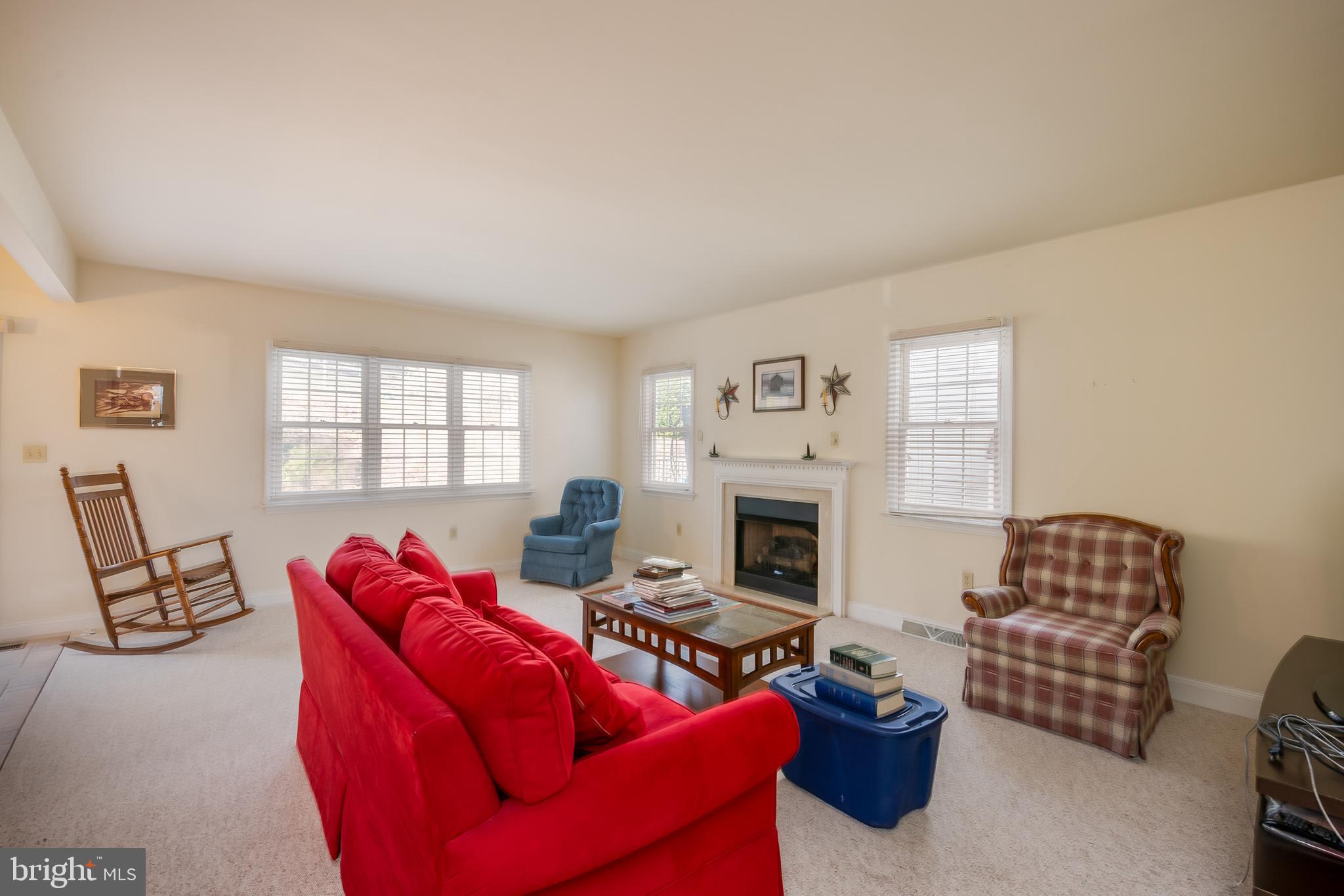 592 Wolfe Lane Mohnton, PA 19540 - Photo 7 of 31 a living room with furniture a flat screen tv and a fireplace