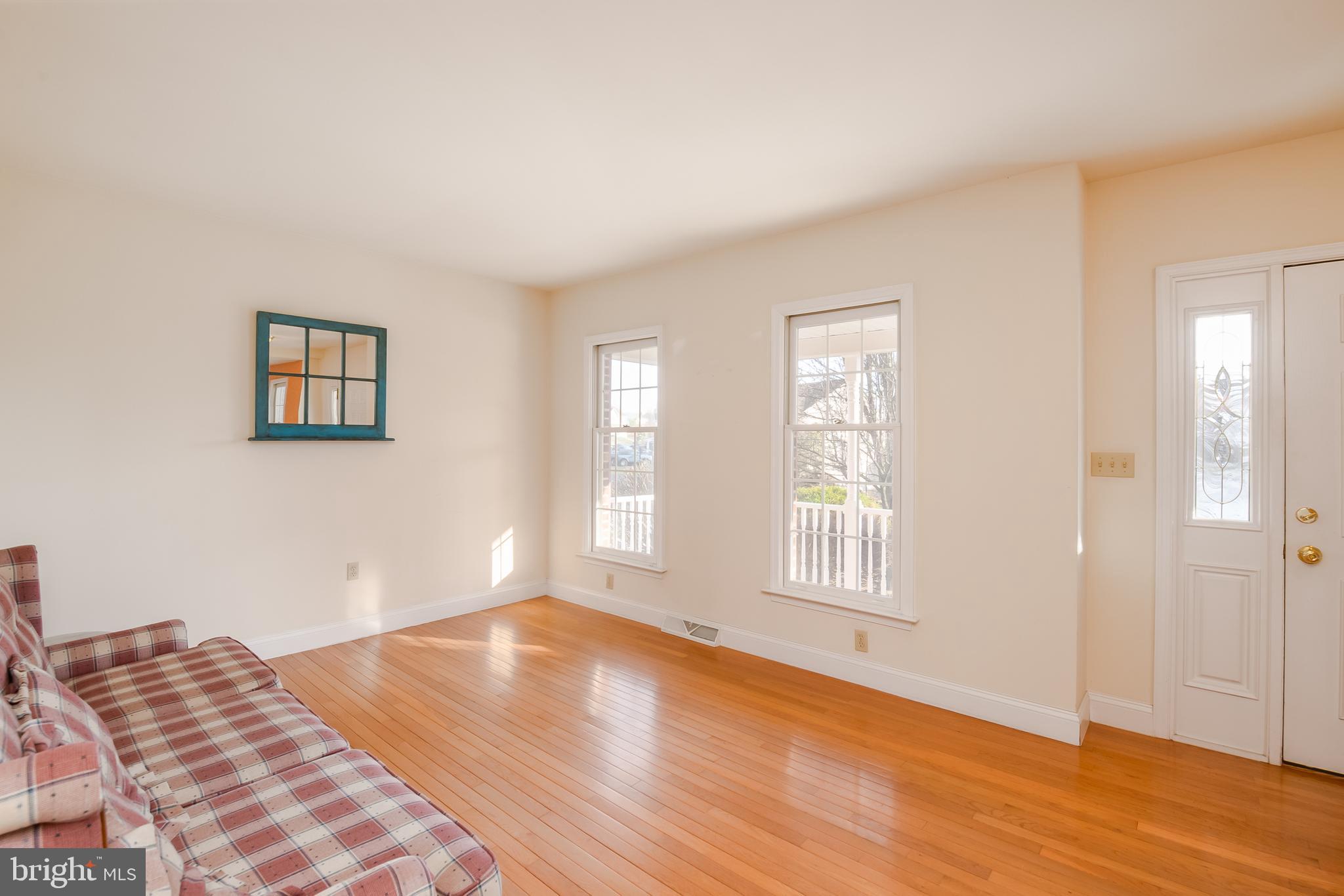 592 Wolfe Lane Mohnton, PA 19540 - Photo 9 of 31 a view of an empty room with wooden floor and a window
