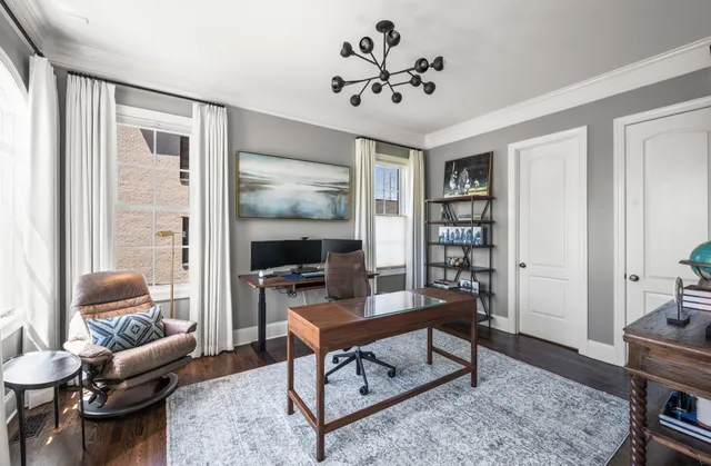 a living room with fireplace furniture and a flat screen tv