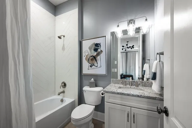 a living room with patio furniture and a flat screen tv