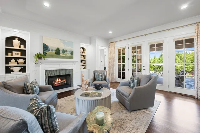 a living room with furniture fireplace and a flat screen tv