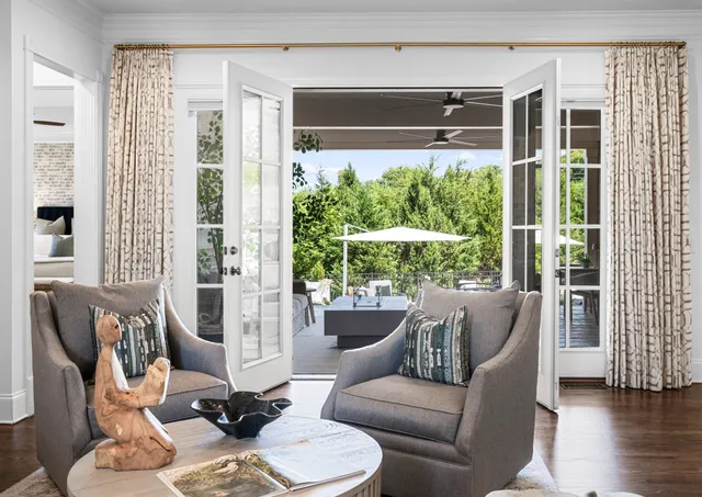 a kitchen with stainless steel appliances granite countertop a kitchen island a stove a sink a refrigerator and cabinets