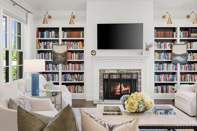 a bedroom with a balcony a bed and a window