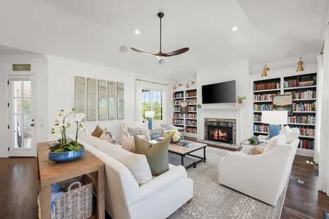 a spacious bathroom with a granite countertop sink a mirror and a shower