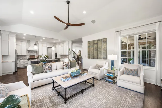a bedroom with furniture and a wooden floor