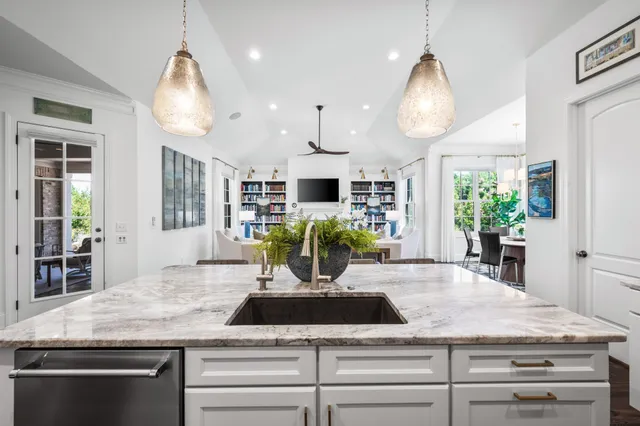 a spacious bedroom with a bed and a large window