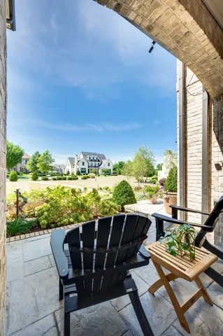 a view of staircase and living room with wooden floor