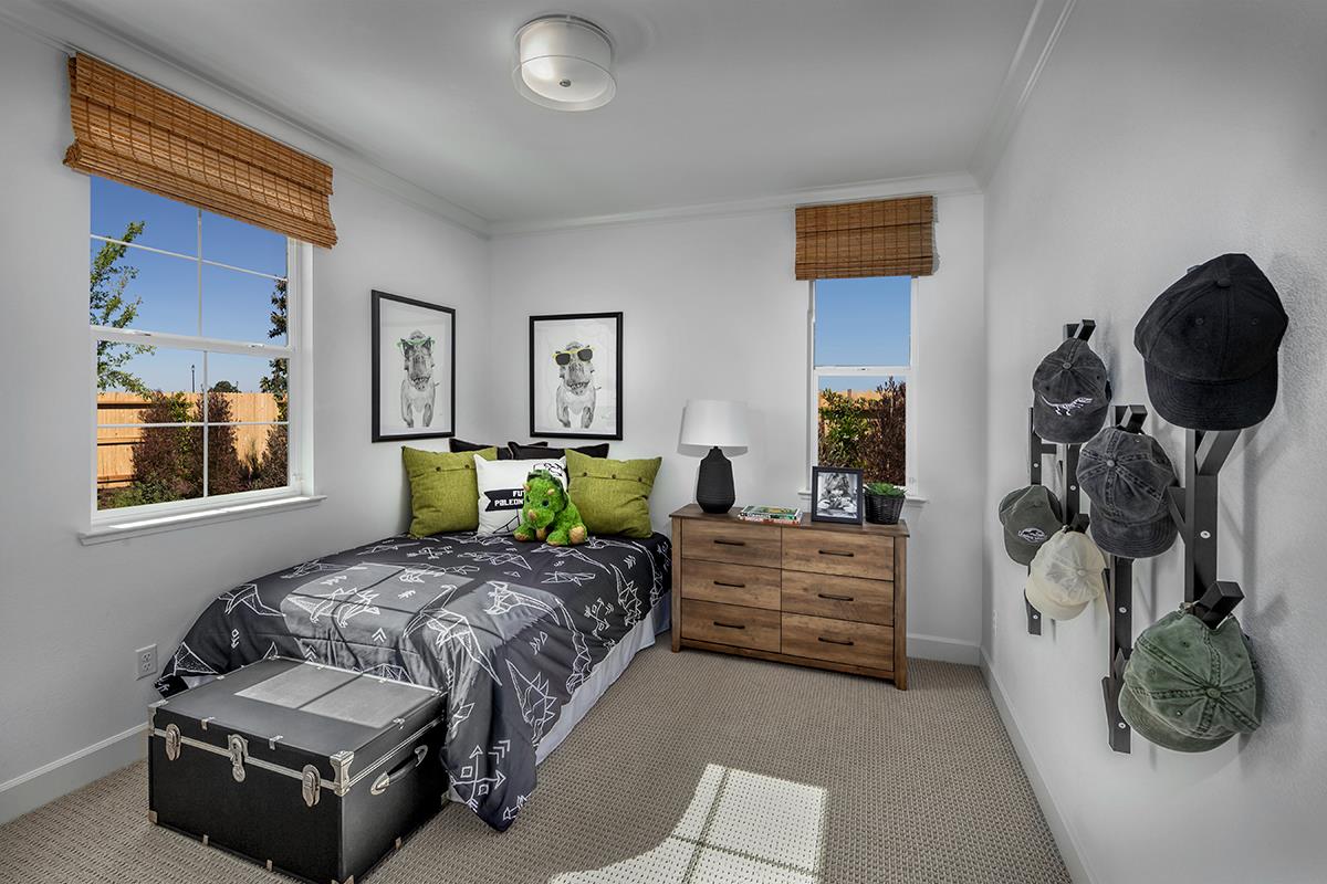 3235 Lourdes Avenue Clovis, CA 93619 - Photo 12 of 13 a bedroom with a bed and dresser