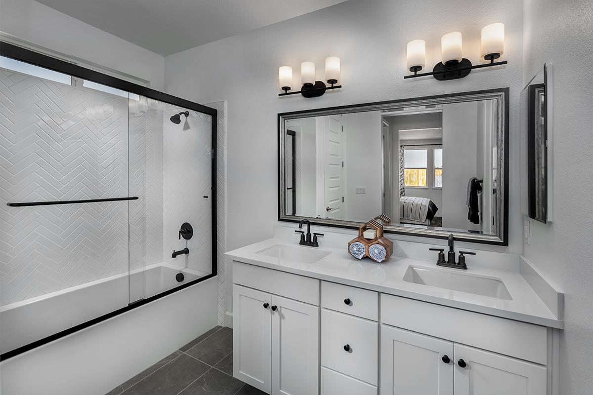 3235 Lourdes Avenue Clovis, CA 93619 - Photo 13 of 13 a bathroom with double vanity and a mirror
