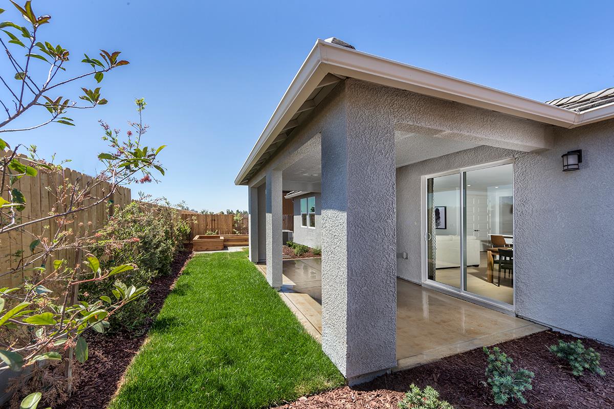 3235 Lourdes Avenue Clovis, CA 93619 - Photo 2 of 13 a front view of a house with a yard