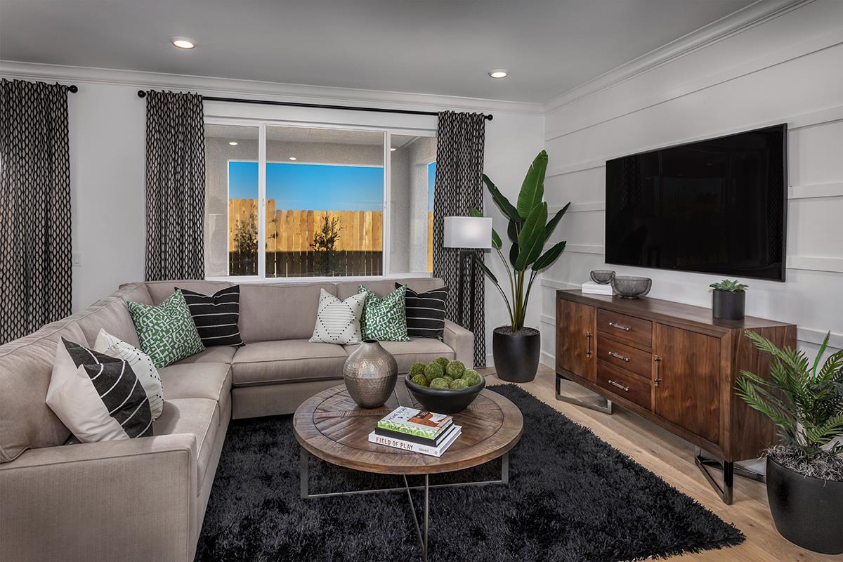 3235 Lourdes Avenue Clovis, CA 93619 - Photo 7 of 13 a living room with furniture and a flat screen tv