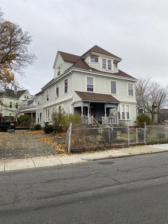29 East Cottage Street Boston, MA 02125 - Photo 2 of 13 a front view of a house with a yard