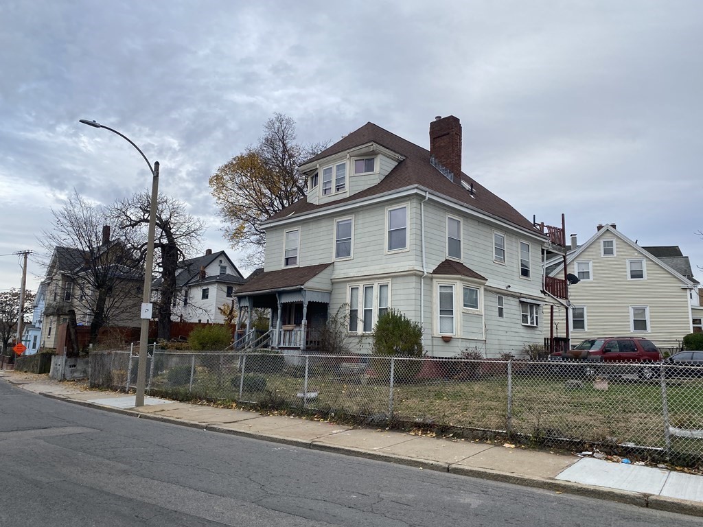 29 East Cottage Street Boston, MA 02125 - Photo 3 of 13 a front view of a house with a yard