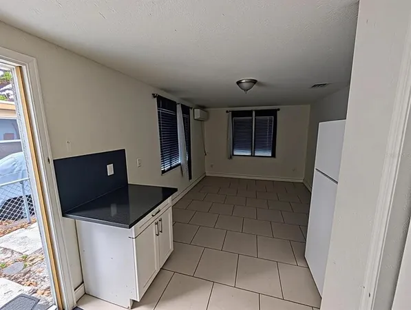 a bedroom with a bed and flat screen tv