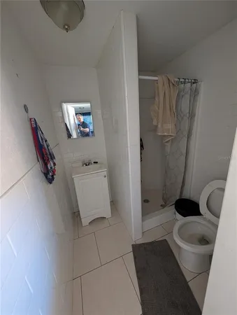 a utility room with dryer washer and other items