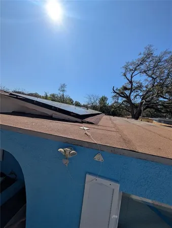 a bedroom with a bed and a tv on the table