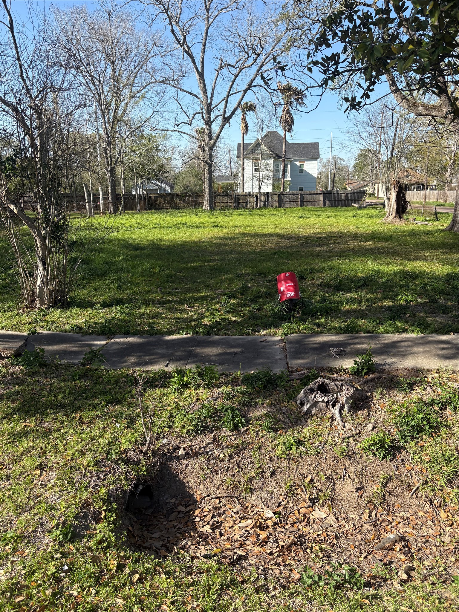 1110 Pipkin Street Beaumont, TX 77705 - Photo 6 of 6 a backyard of a house with a yard and outdoor seating
