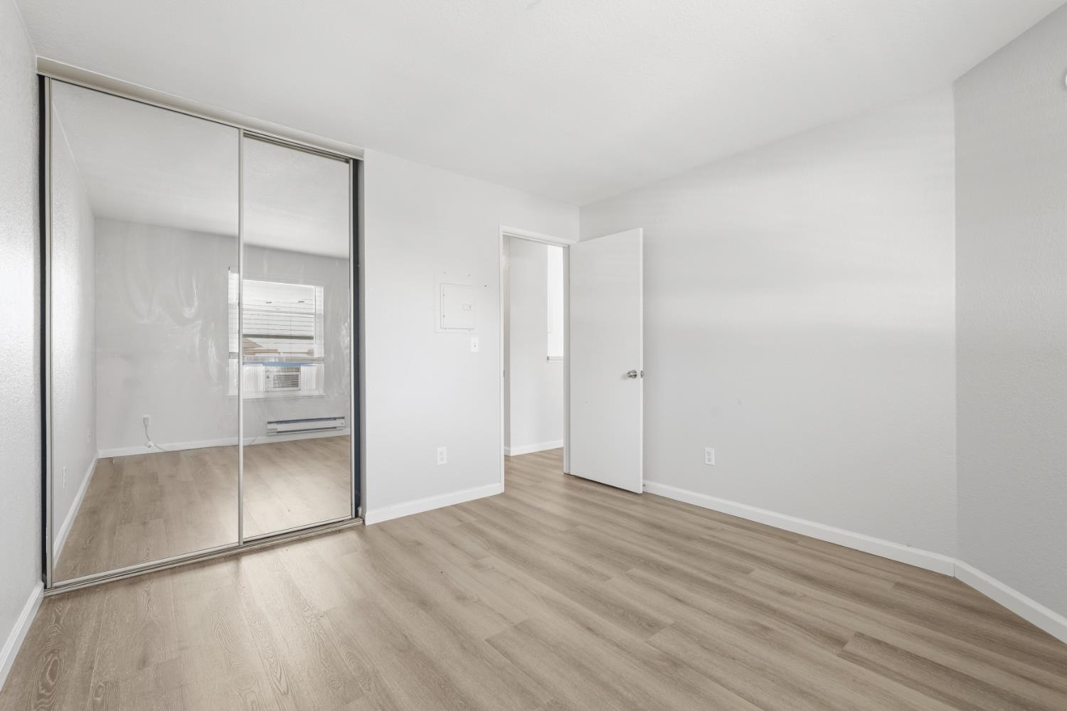 3 Lancaster Circle, Unit 209 Bay Point, CA 94565 - Photo 16 of 30 a view of an empty room with wooden floor and closet
