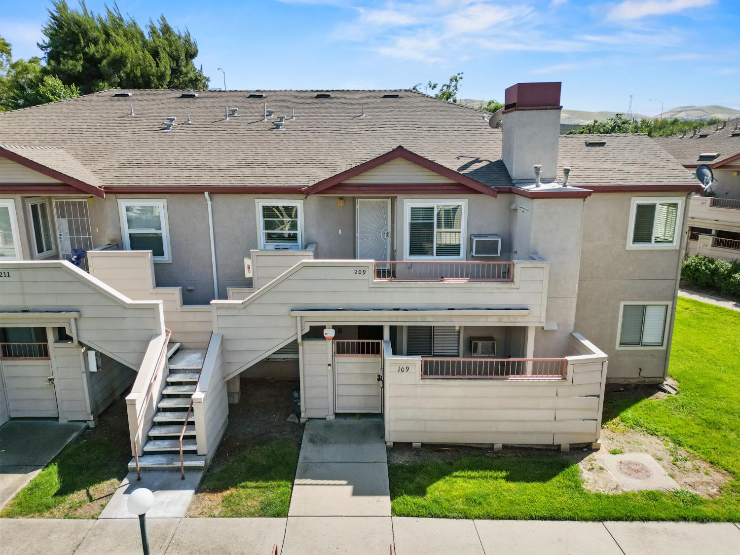 3 Lancaster Circle, Unit 209 Bay Point, CA 94565 - Photo 23 of 30 a front view of a house with a garden