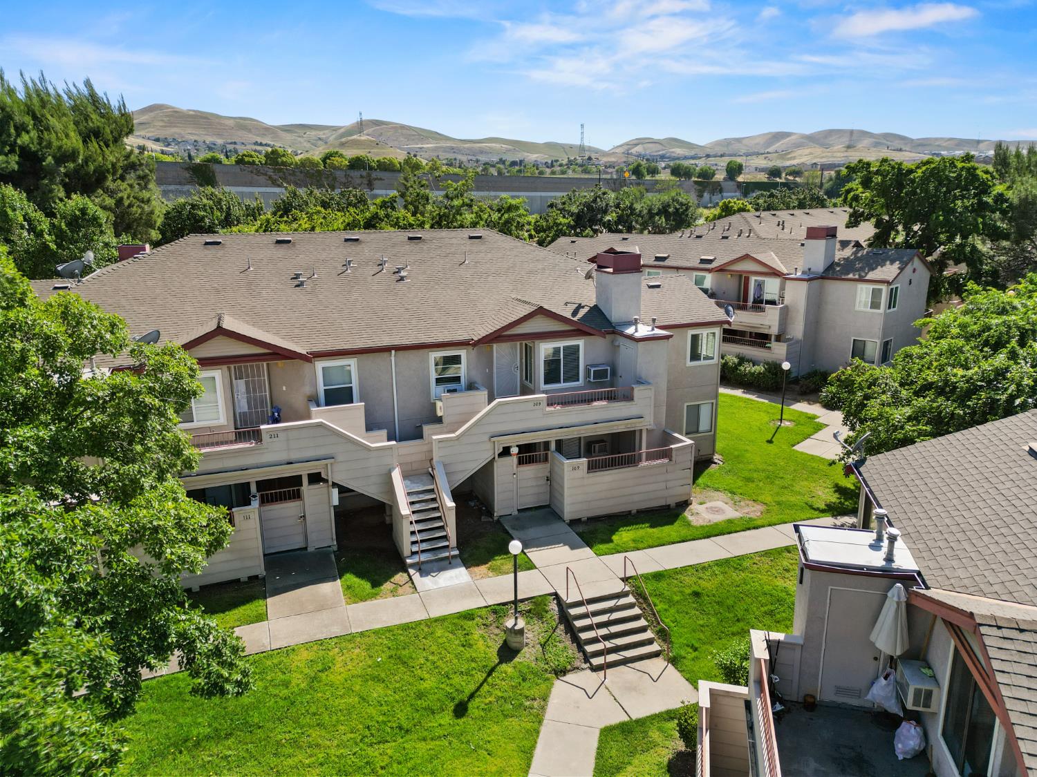 3 Lancaster Circle, Unit 209 Bay Point, CA 94565 - Photo 25 of 30 an aerial view of a house with a garden and a mountain view in back yard