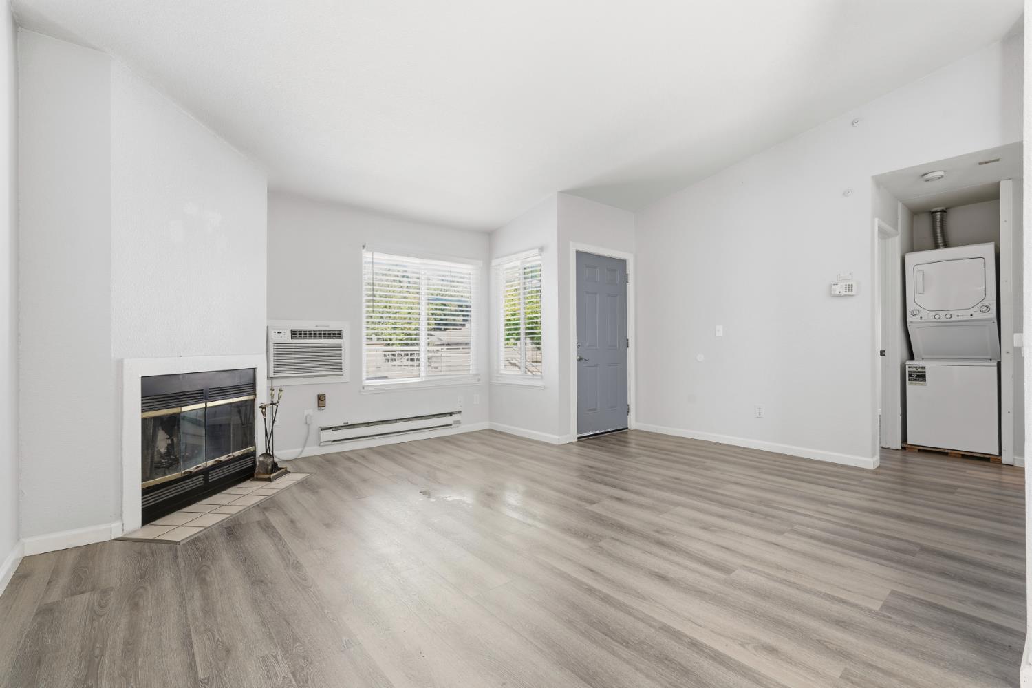 3 Lancaster Circle, Unit 209 Bay Point, CA 94565 - Photo 3 of 30 an empty room with wooden floor cabinet and windows