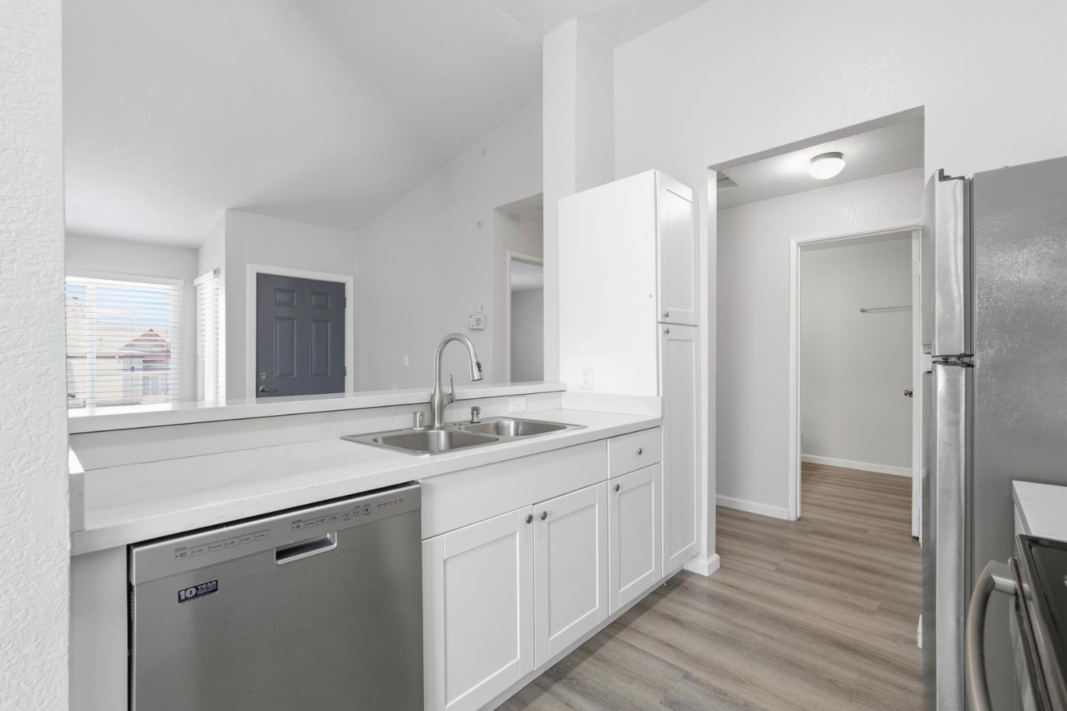 3 Lancaster Circle, Unit 209 Bay Point, CA 94565 - Photo 7 of 30 a kitchen with a sink and refrigerator