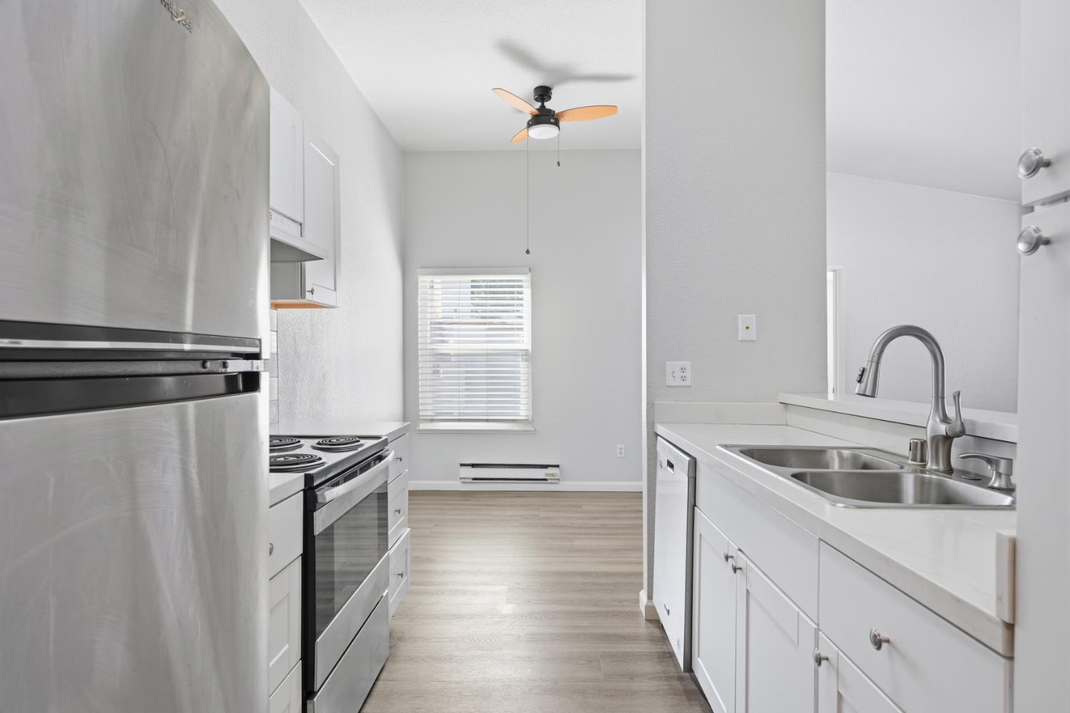 3 Lancaster Circle, Unit 209 Bay Point, CA 94565 - Photo 9 of 30 a kitchen with stainless steel appliances and a sink