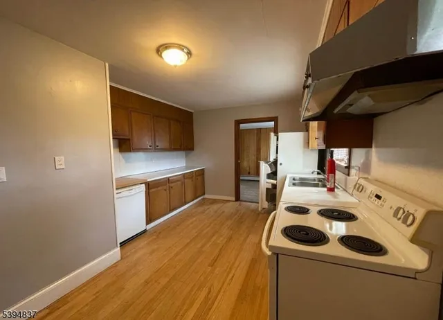 a kitchen with a stove and a microwave