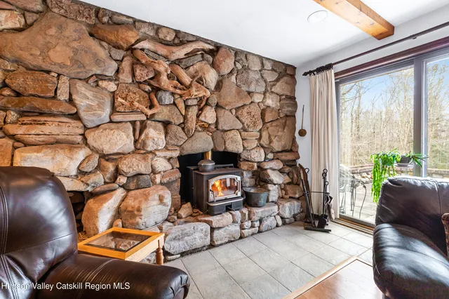 a living room with a couch and a window