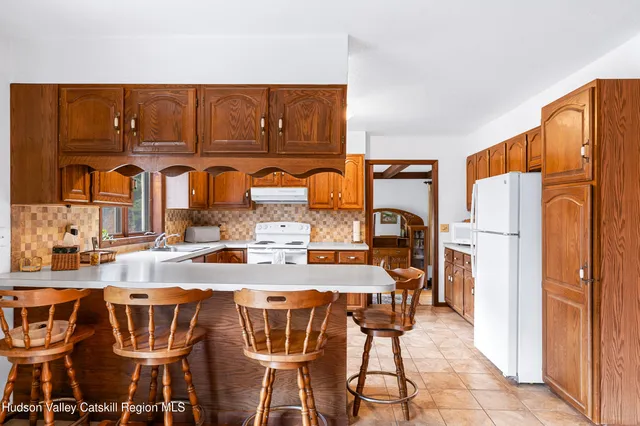 a view of a dining table and chairs