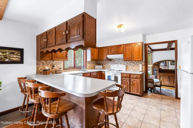 a dinning table and chairs in a kitchen
