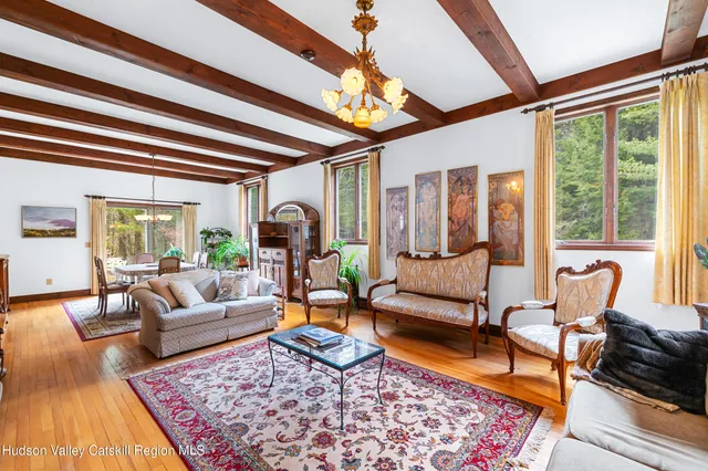 a living room with furniture or couch and a large window