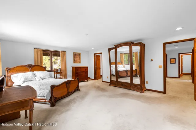 a bedroom with furniture and a fireplace