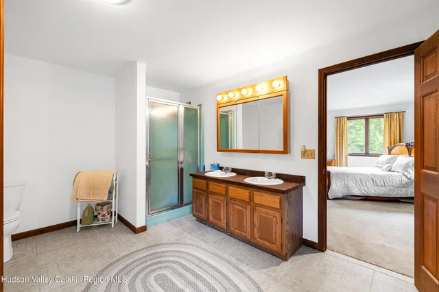 a bedroom with bed and a couch