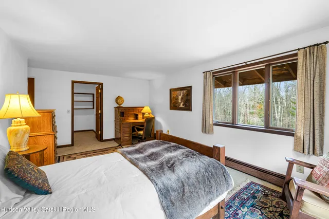 a bedroom with a bed and utility room