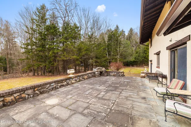 a view of a swimming pool with a lounge chair