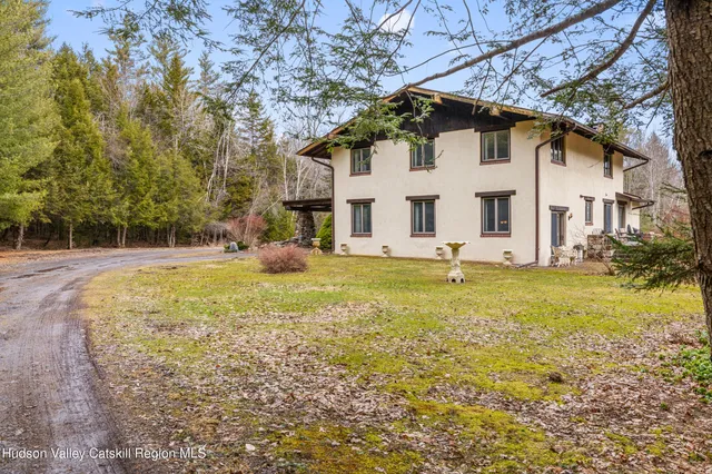 a house view with swimming pool