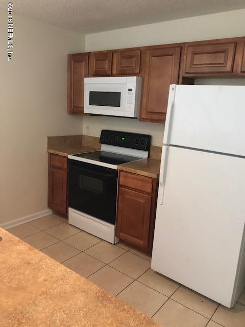 7920 Merrill Road, Unit 1813 Jacksonville, FL 32277 - Photo 2 of 9 a utility room with washer and dryer