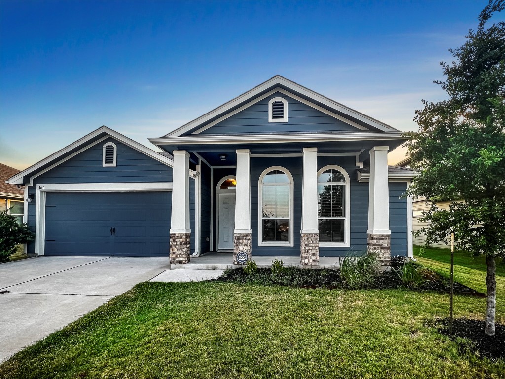 front view of a house with a yard