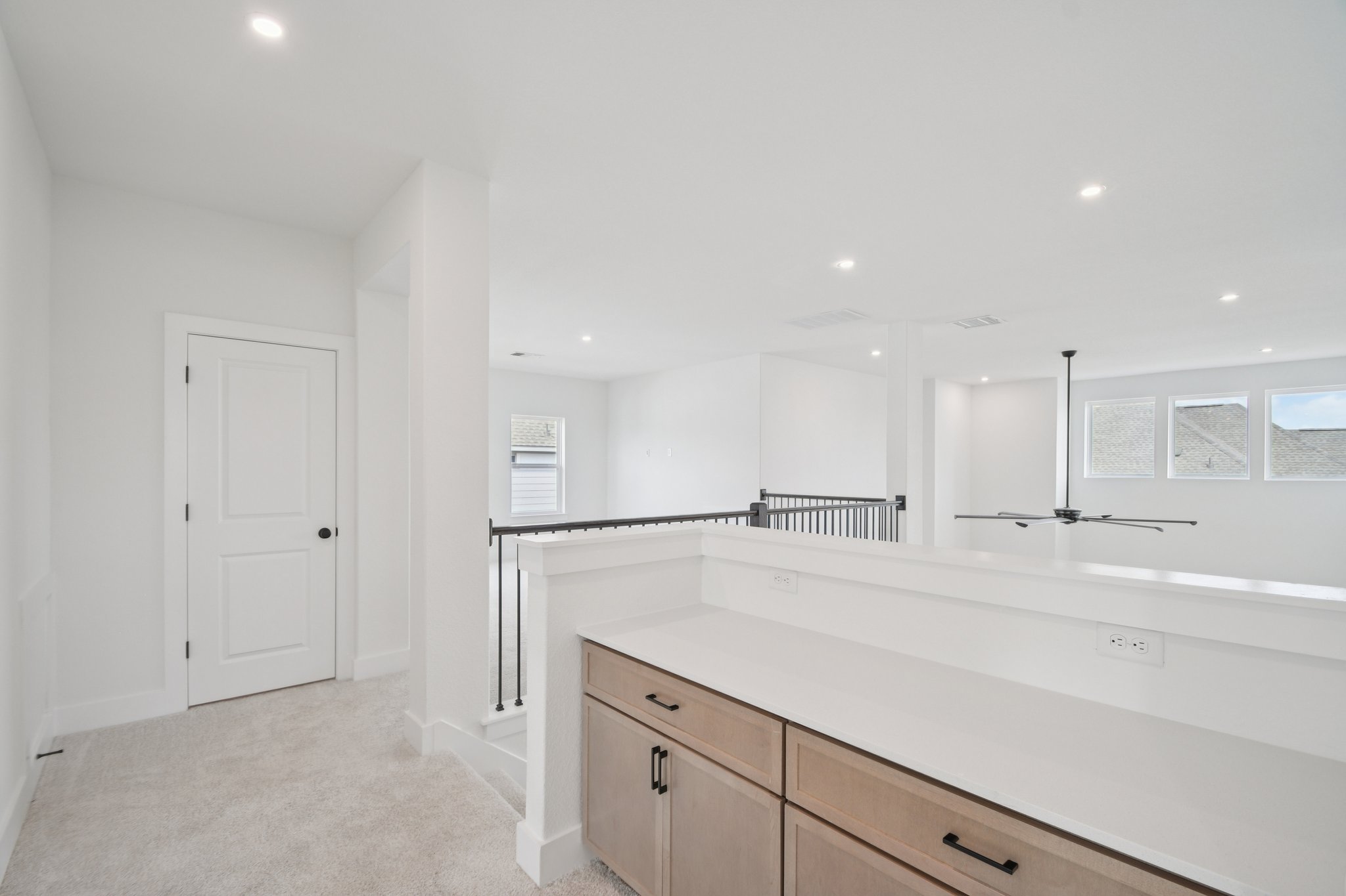 1660 Cardinal Lane Round Rock, TX 78681 - Photo 27 of 35 a view of a kitchen with a sink and a refrigerator