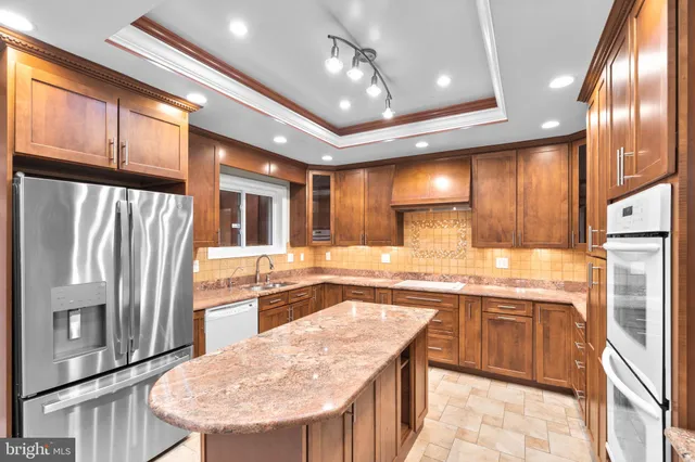 a view of a kitchen with wooden floor