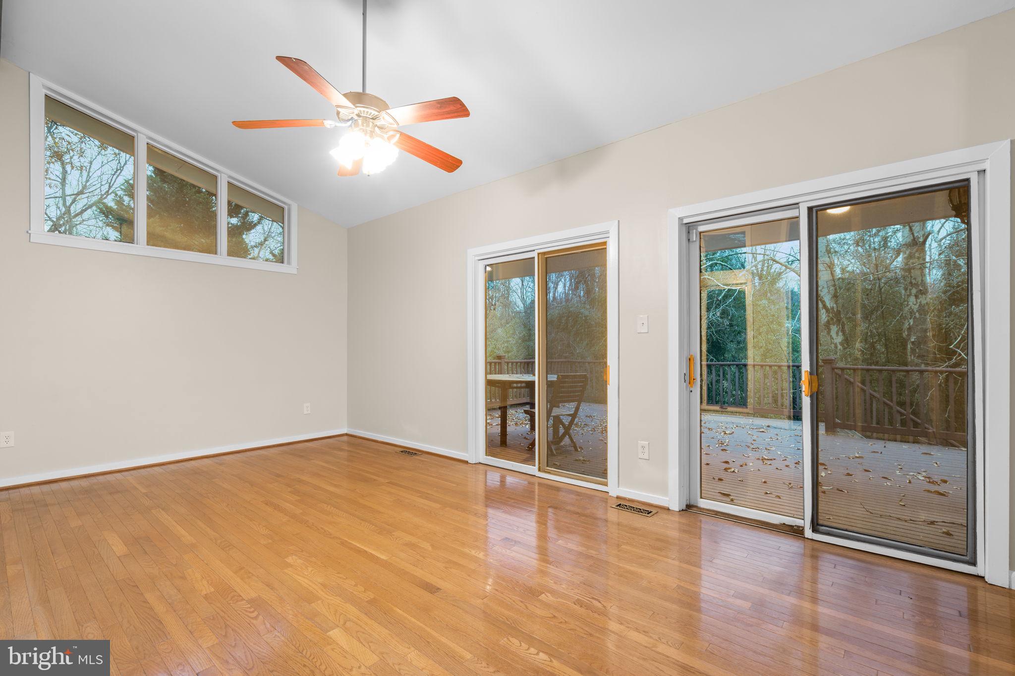 7711 Arrowood Court Bethesda, MD 20817 - Photo 20 of 59 wooden floor in an empty room with a window
