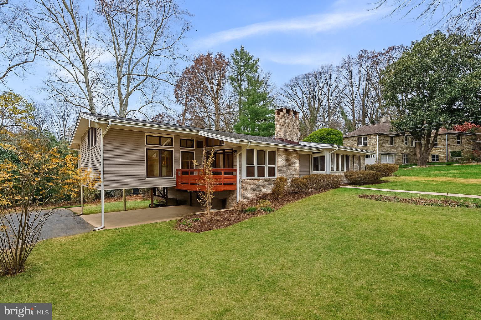 7711 Arrowood Court Bethesda, MD 20817 - Photo 2 of 59 a view of a house with a yard and sitting area