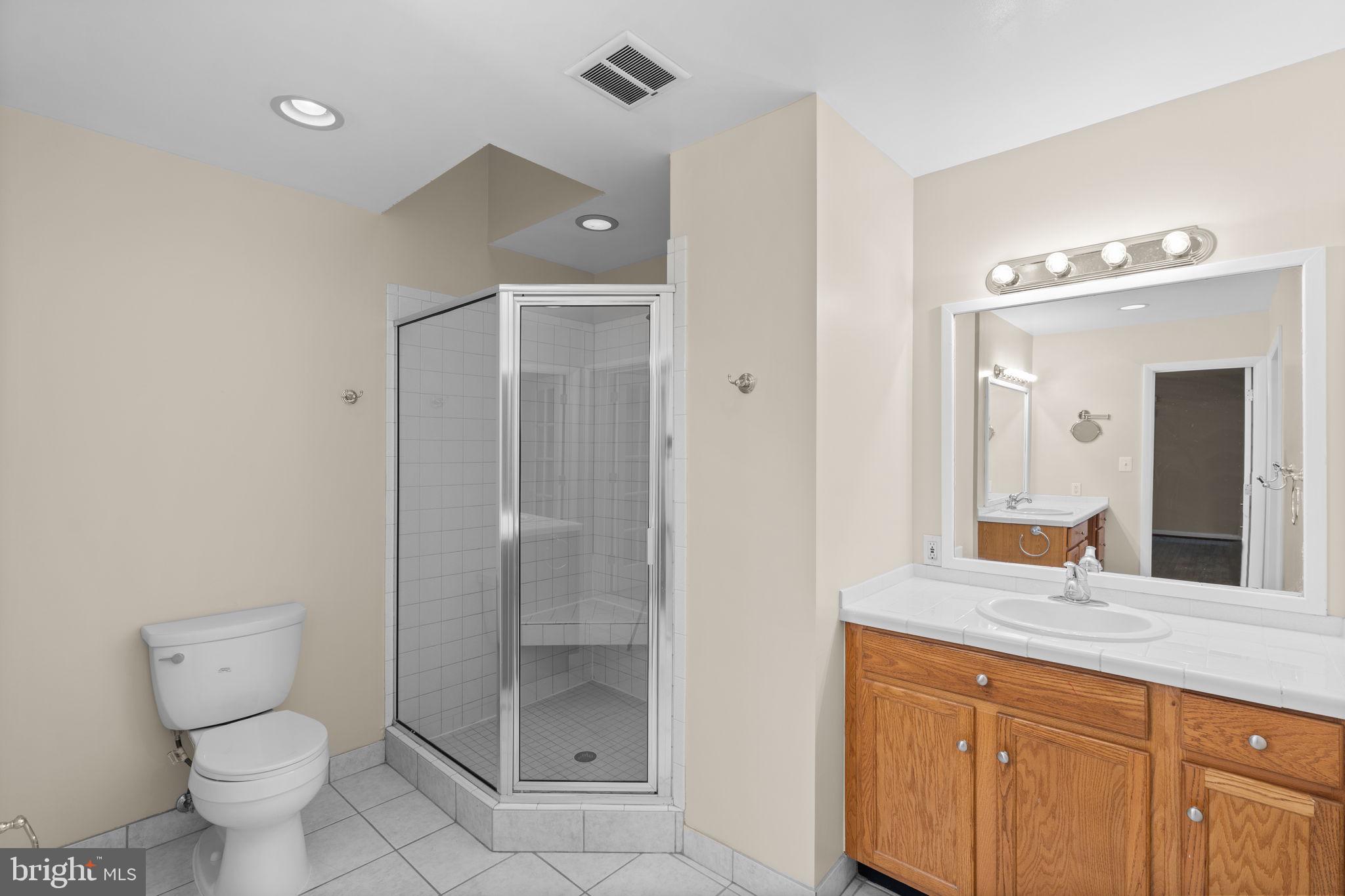 7711 Arrowood Court Bethesda, MD 20817 - Photo 25 of 59 Main floor primary bathroom