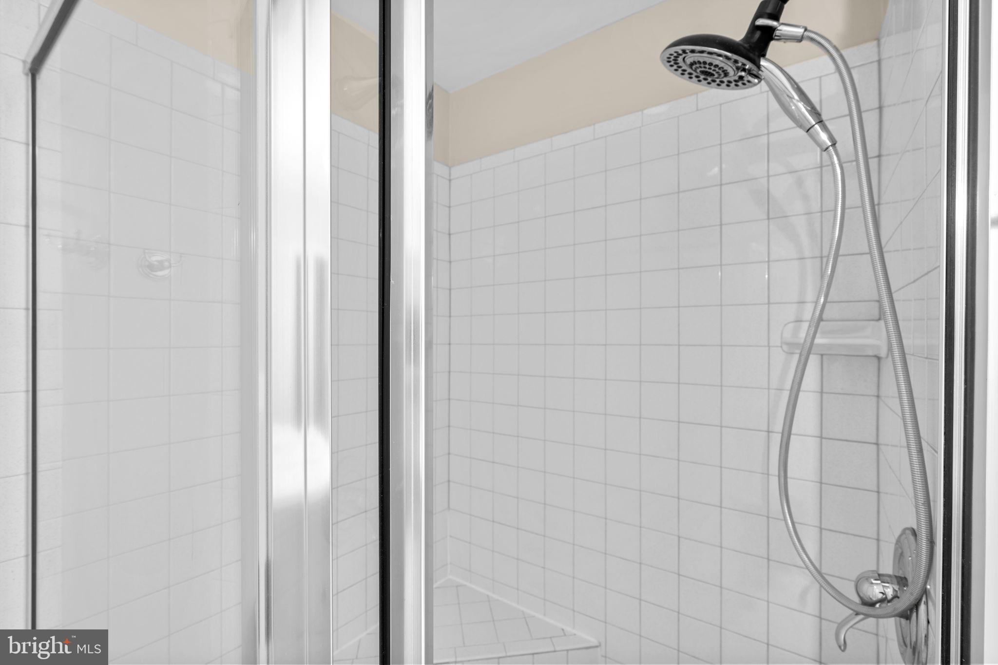 7711 Arrowood Court Bethesda, MD 20817 - Photo 26 of 59 a bathroom with a shower