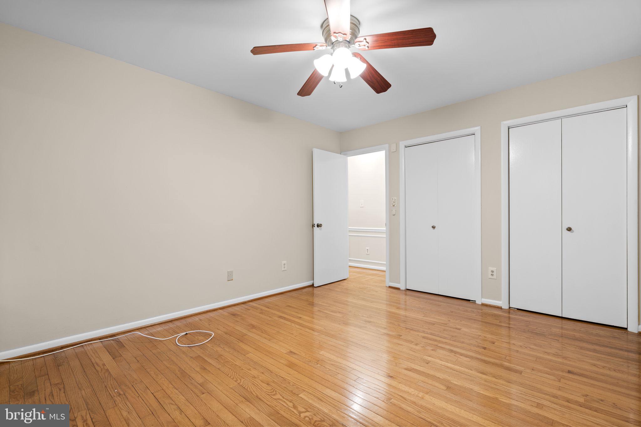 7711 Arrowood Court Bethesda, MD 20817 - Photo 30 of 59 a view of an empty room with wooden floor